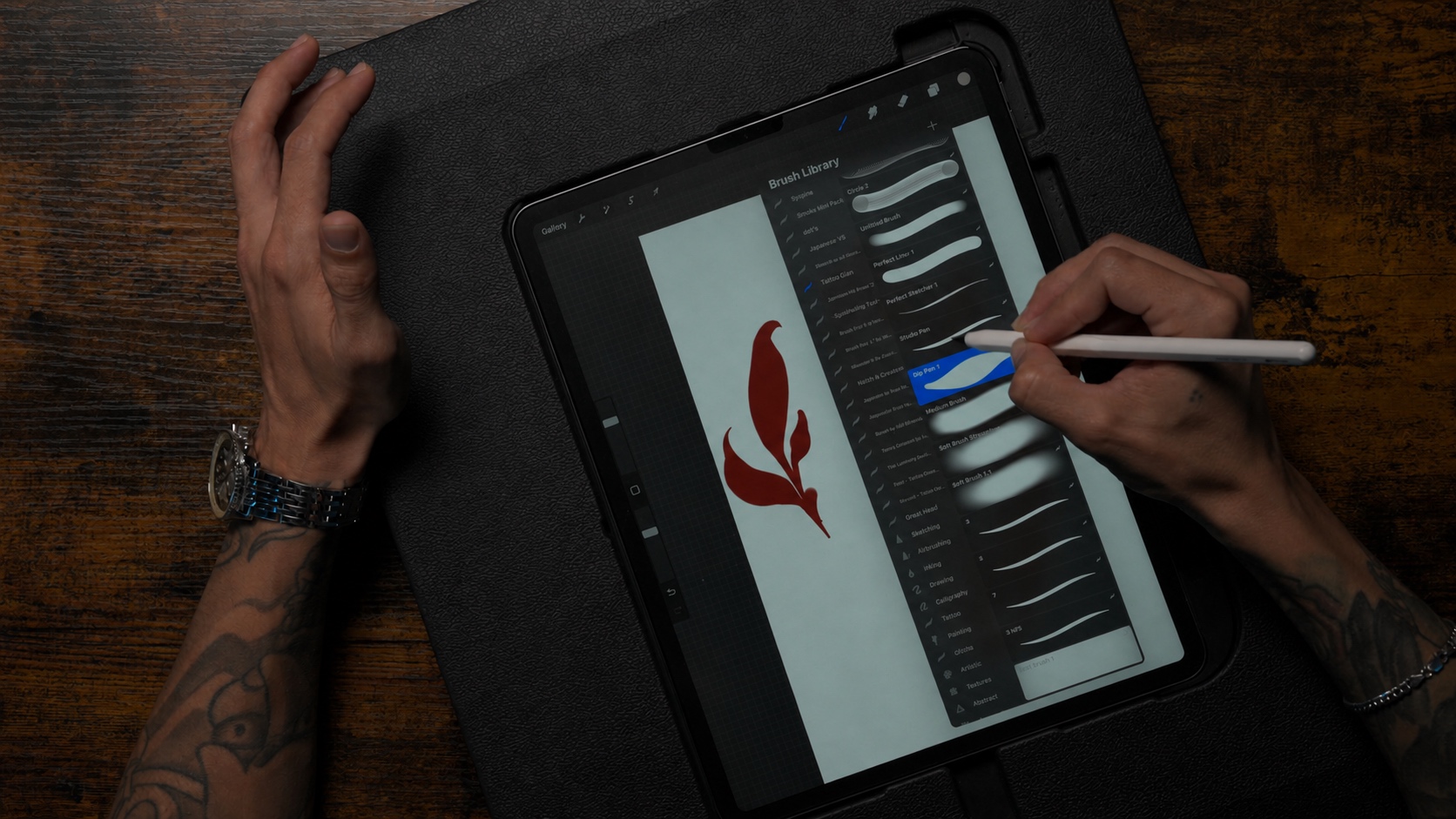 Gian working on iPad in Procreate with custom brush library open, the drawing setup behind every neo-traditional design